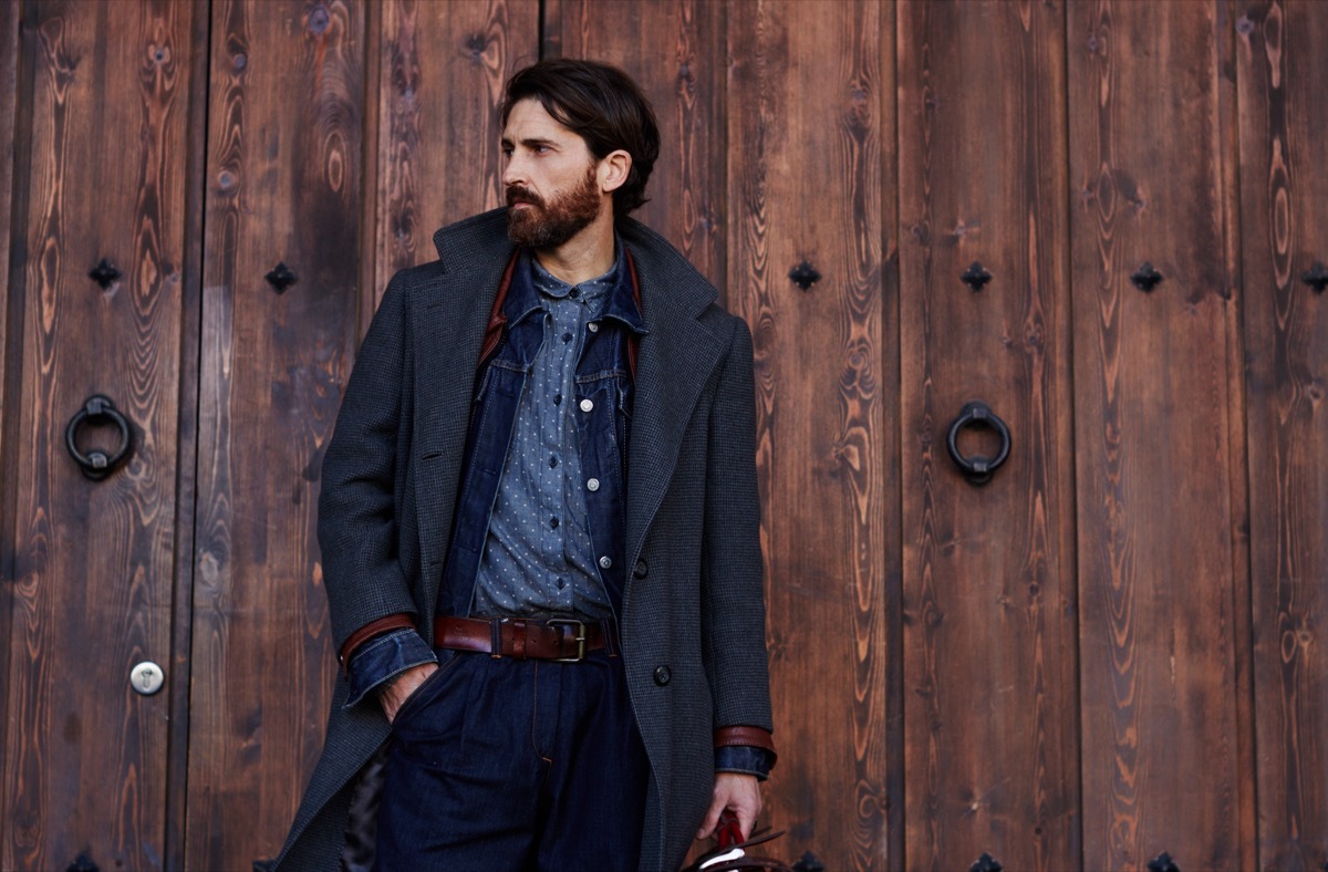 Well Dressed Man Leaning on Wall