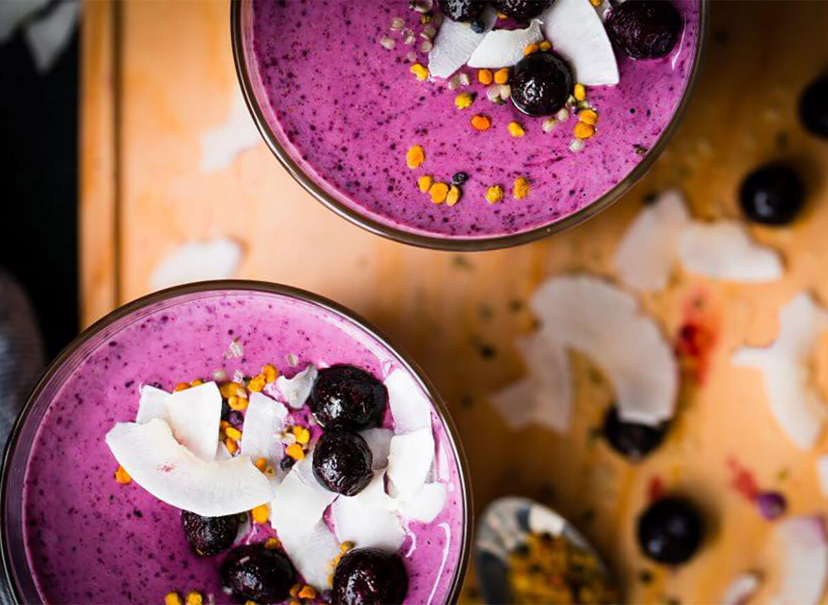 simple berry smoothies topped with blueberries and coconut chips