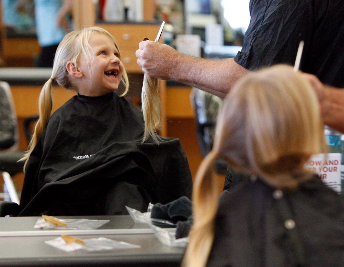 CD8P79 Jun. 04, 2010 - Hudson - BRENDAN FITTERER | Times.PT_323343_FITT_locks_2 (06/04/2010 Hudson) .Gabriel Maddox (cq), 4, reacts to the sight of 11 inches of hair trimmed from his head. He and his brother Kody, 10, who cut off 16 inches of hair, are donating to Locks of Love..BRENDAN FITTERER | Time