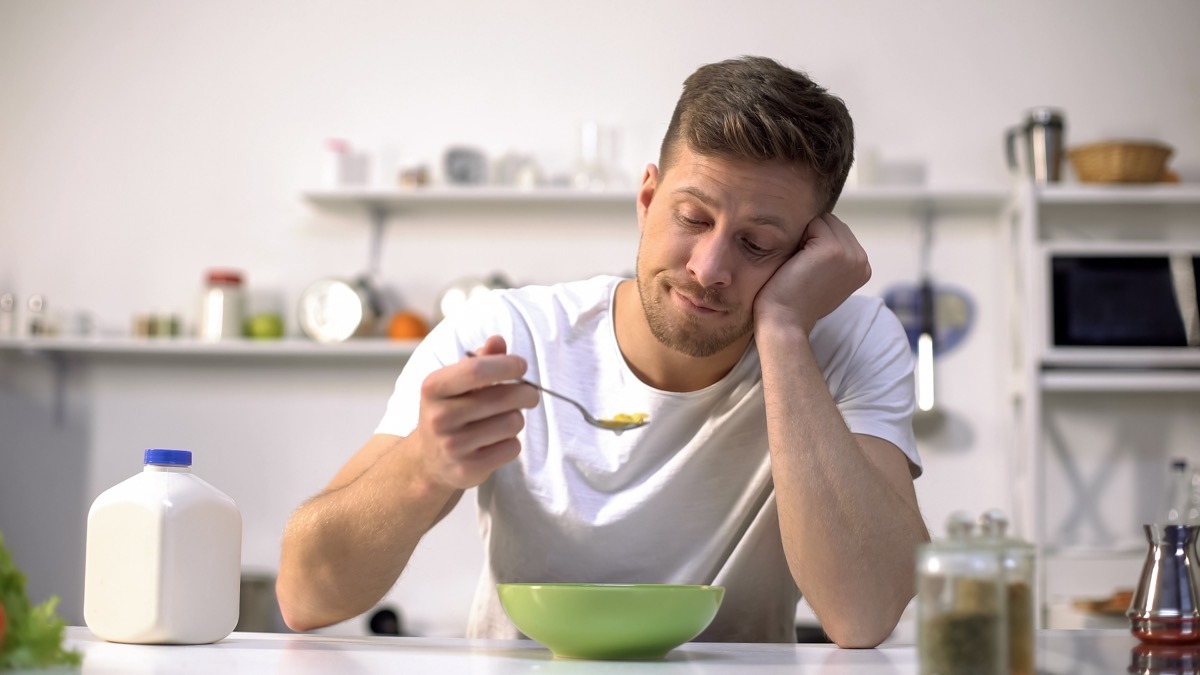 Man without taste eating cereal