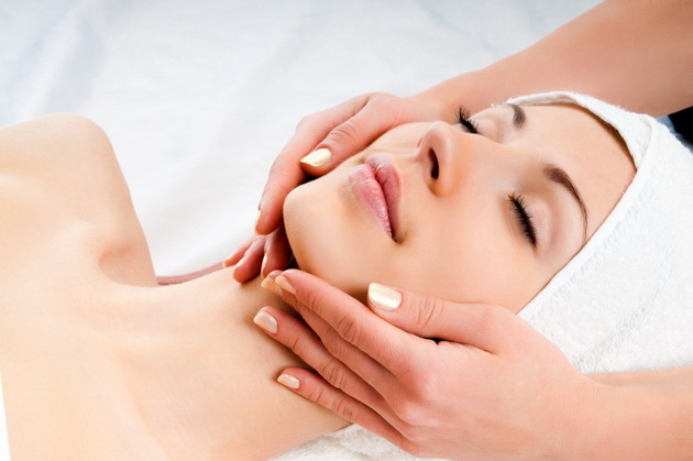 woman receiving facial massage