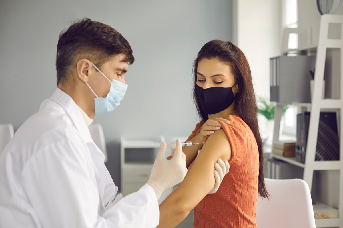 Woman getting COVID vaccine