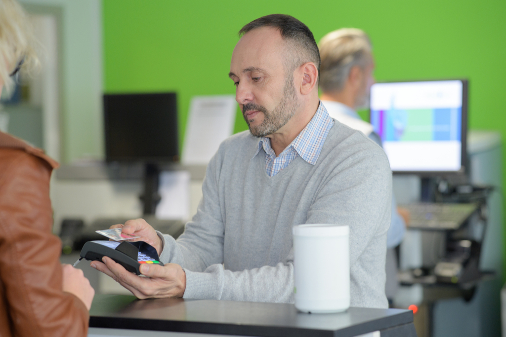 Man Showing Cashier ID Worst Things to Say to Customer Service