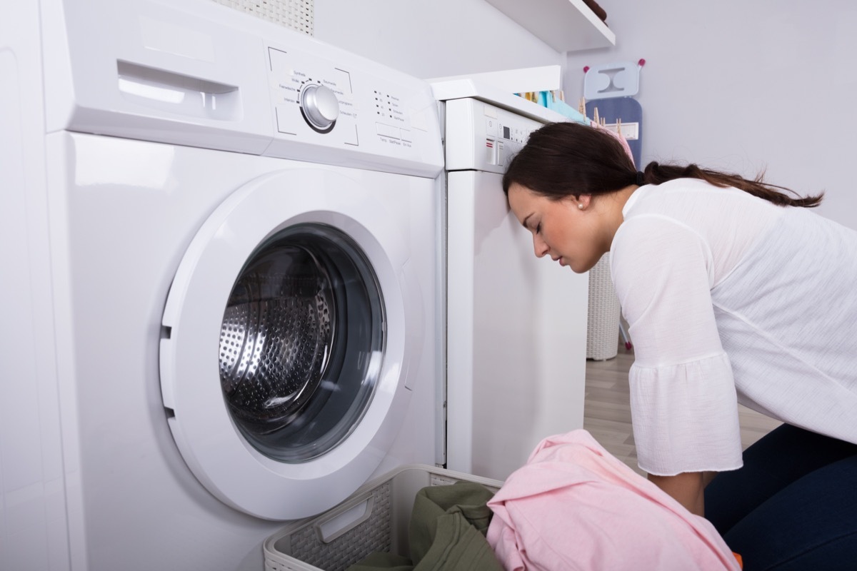 frustrated woman doing laundry