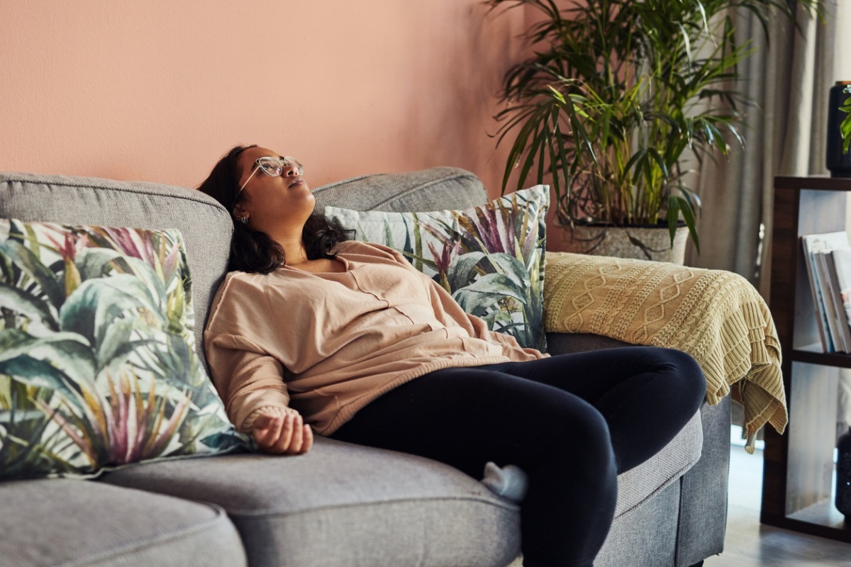 woman laying around on couch