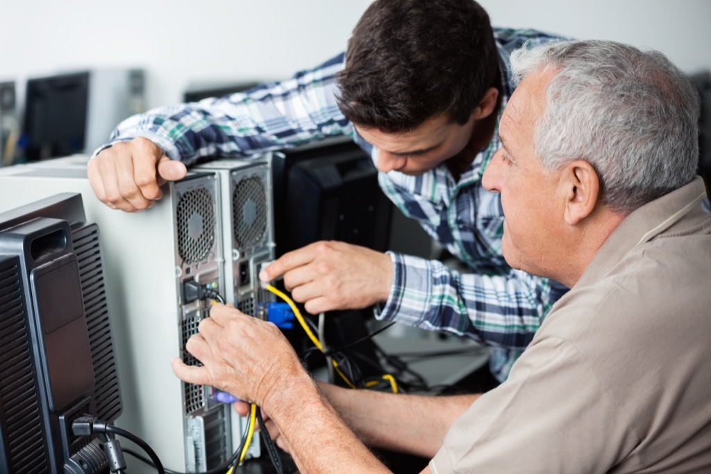 Millennial man helping Baby boomer Facts About Millennials