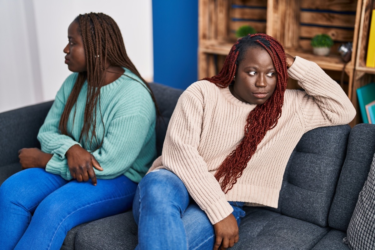 two women in the middle of a disagreement