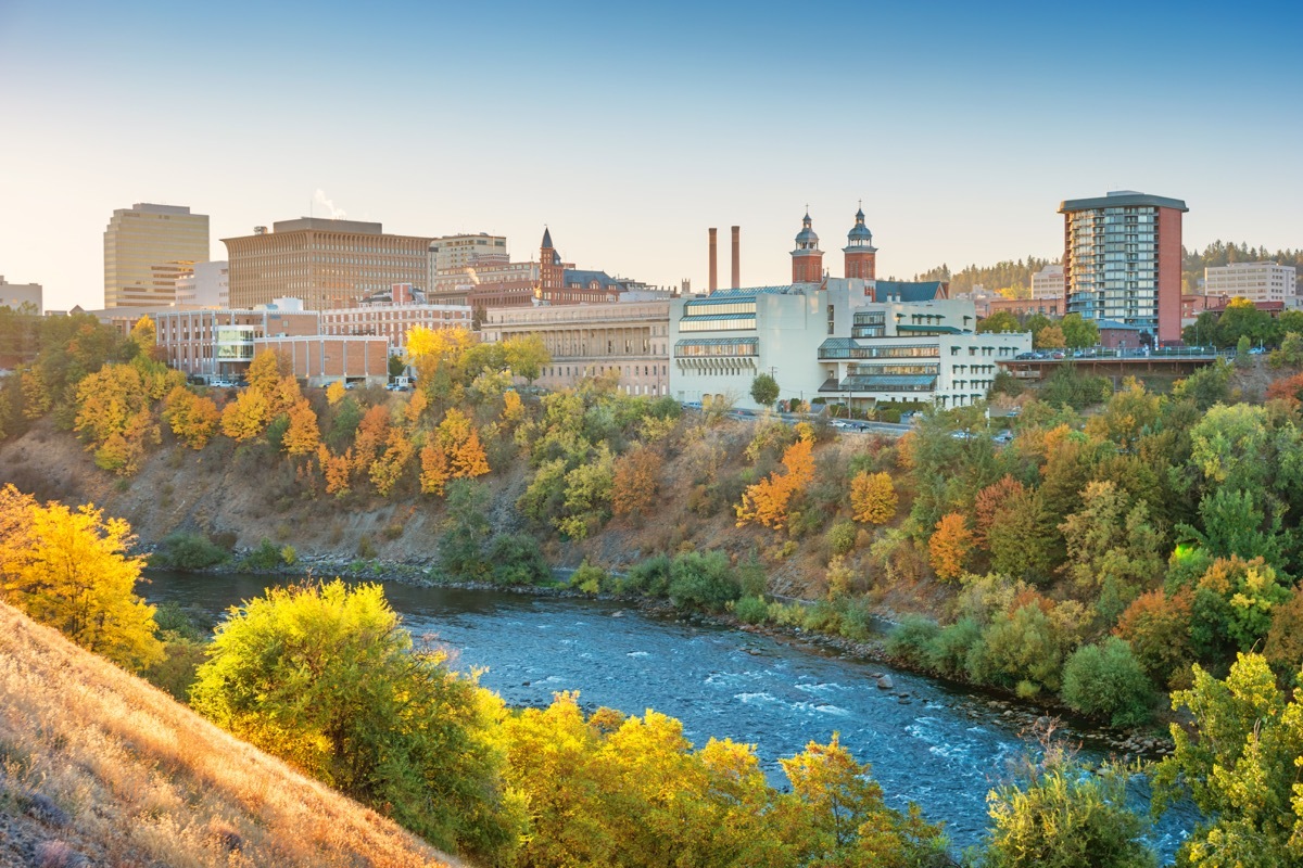 Stock photograph of the downtown Spokane, Washington skyline and the Spokane River at sunrise.