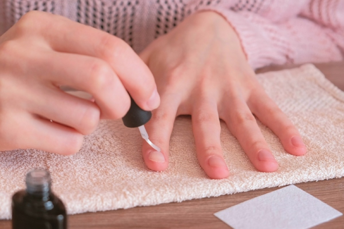 applying cuticle oil to nails after removing gel polish