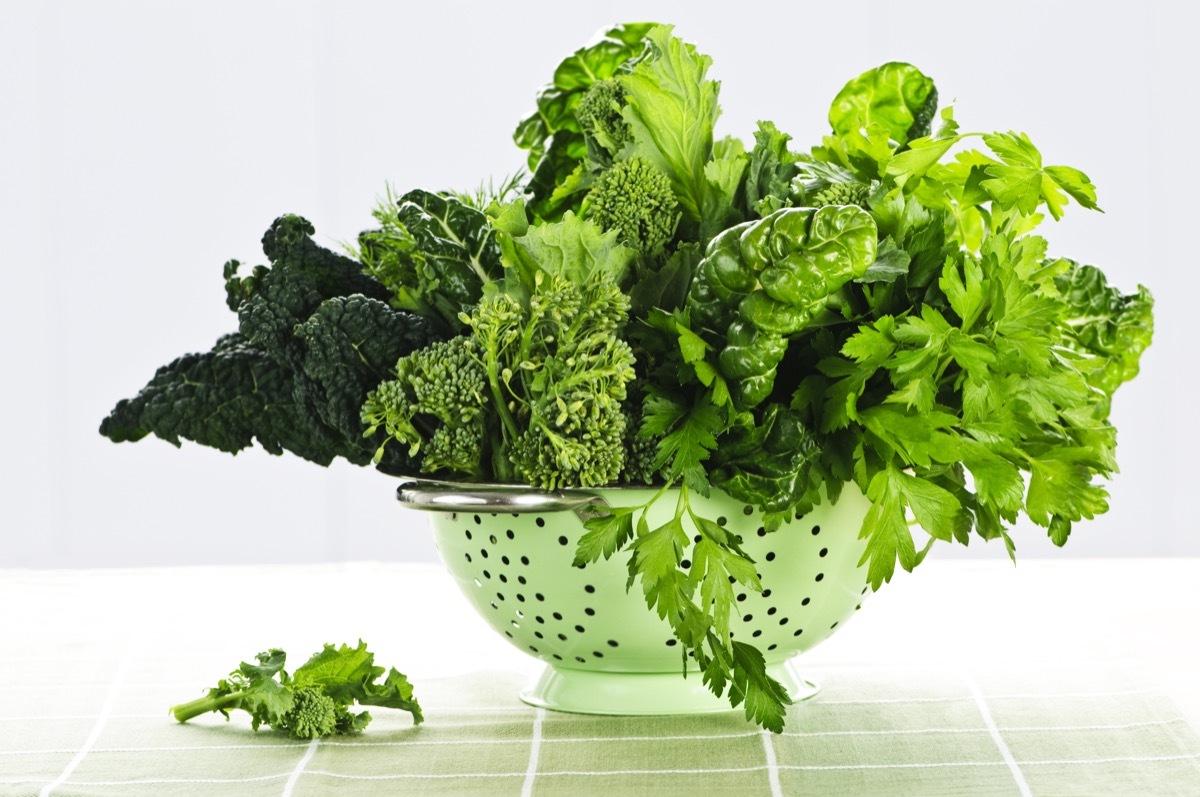 leafy greens in metal colander