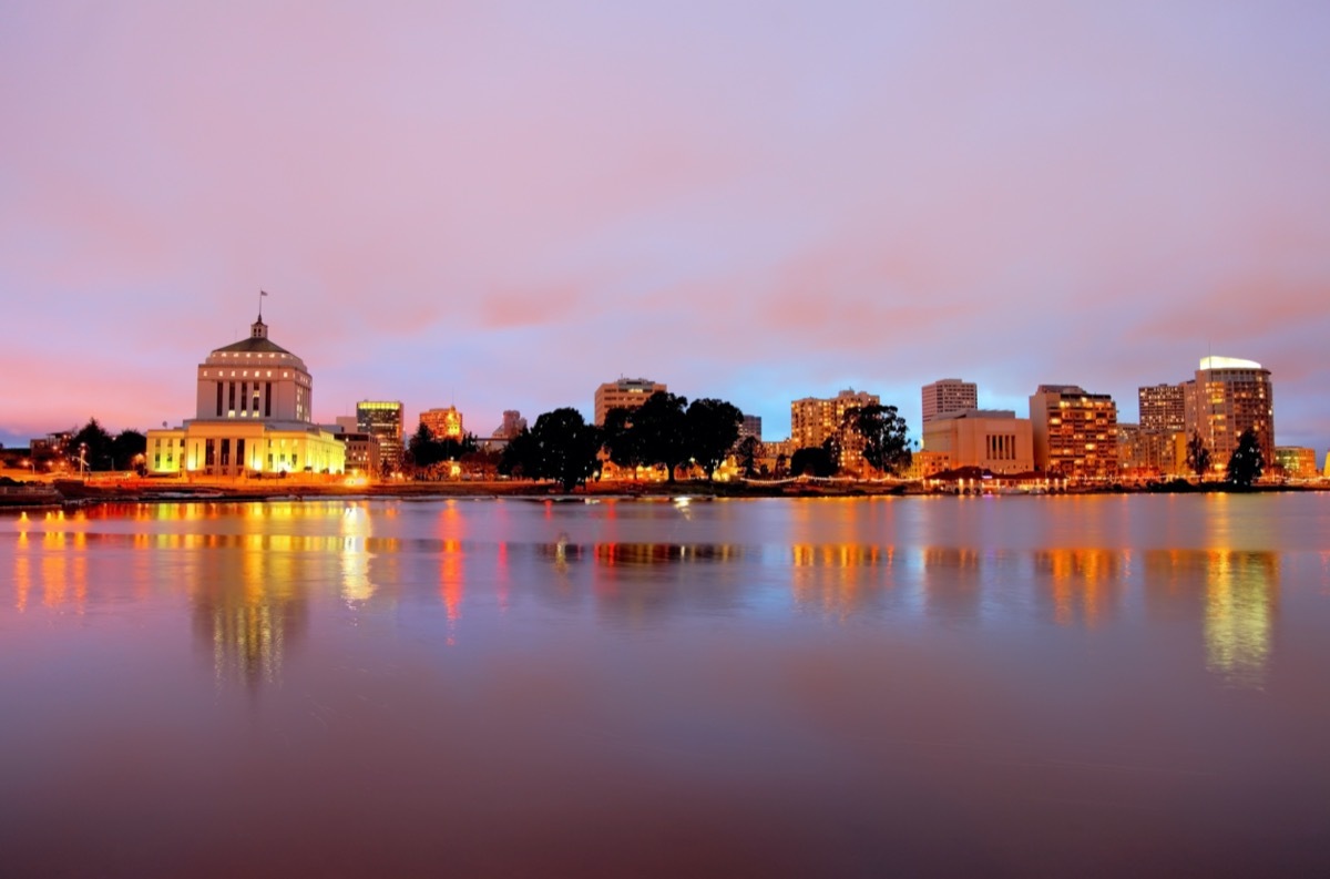 city skyline of and Lake Merritt in Oakland, California at dusk