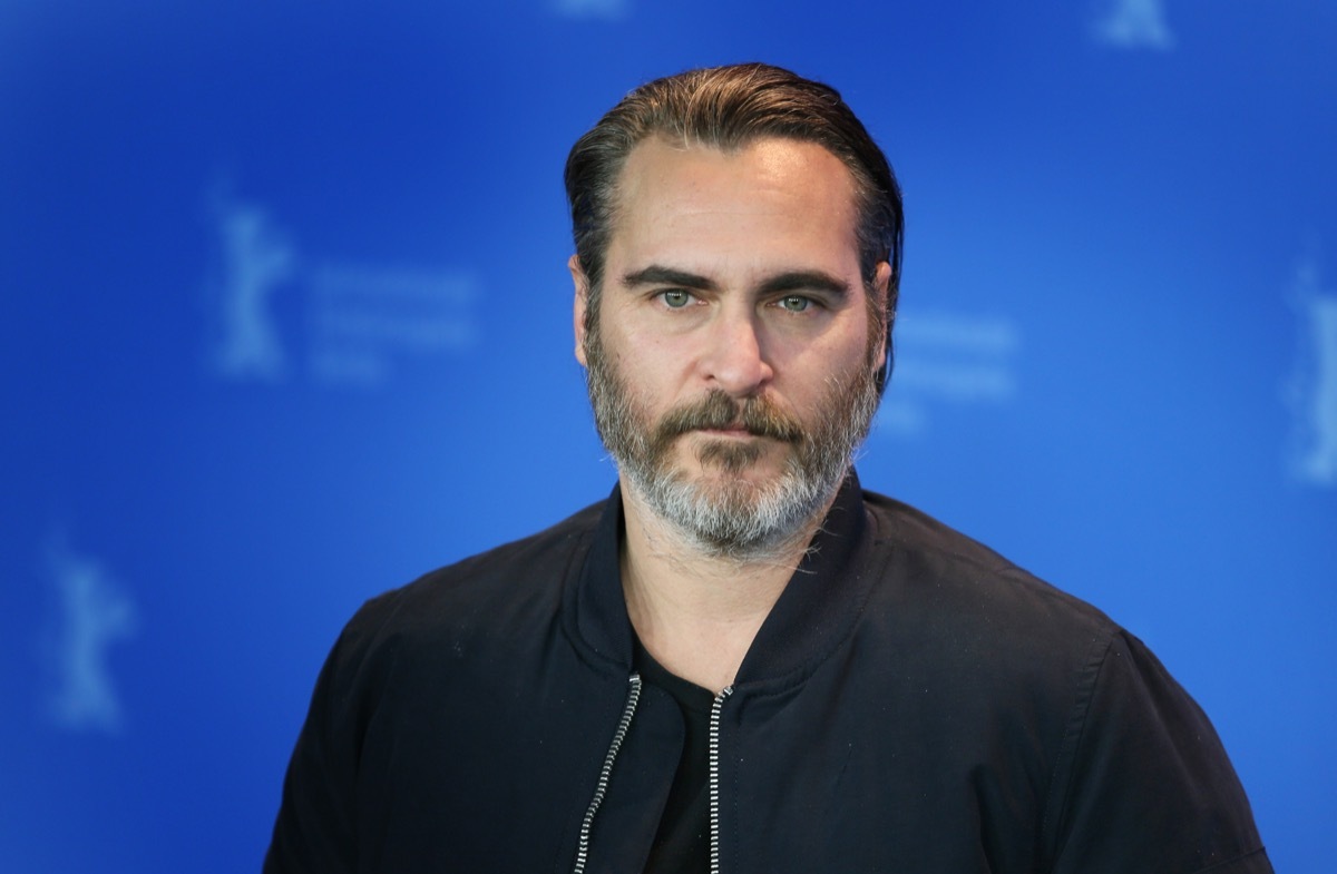 vegan celebrities - Joaquin Phoenix poses at the 'Don't Worry, He Won't Get Far on Foot' photo call during the 68th Berlinale Film Festival Berlin at Hyatt Hotel on February 20, 2018 in Berlin, Germany. - Image