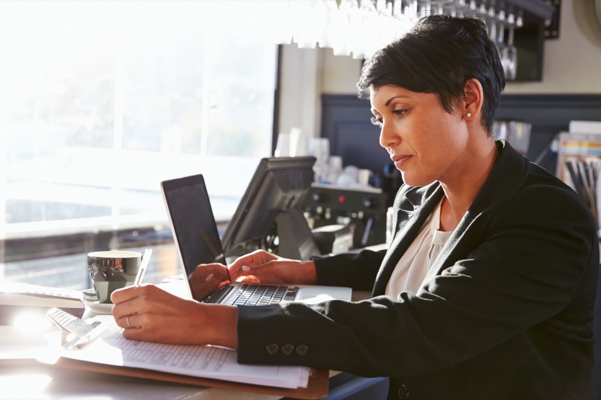 middle age woman writing down notes